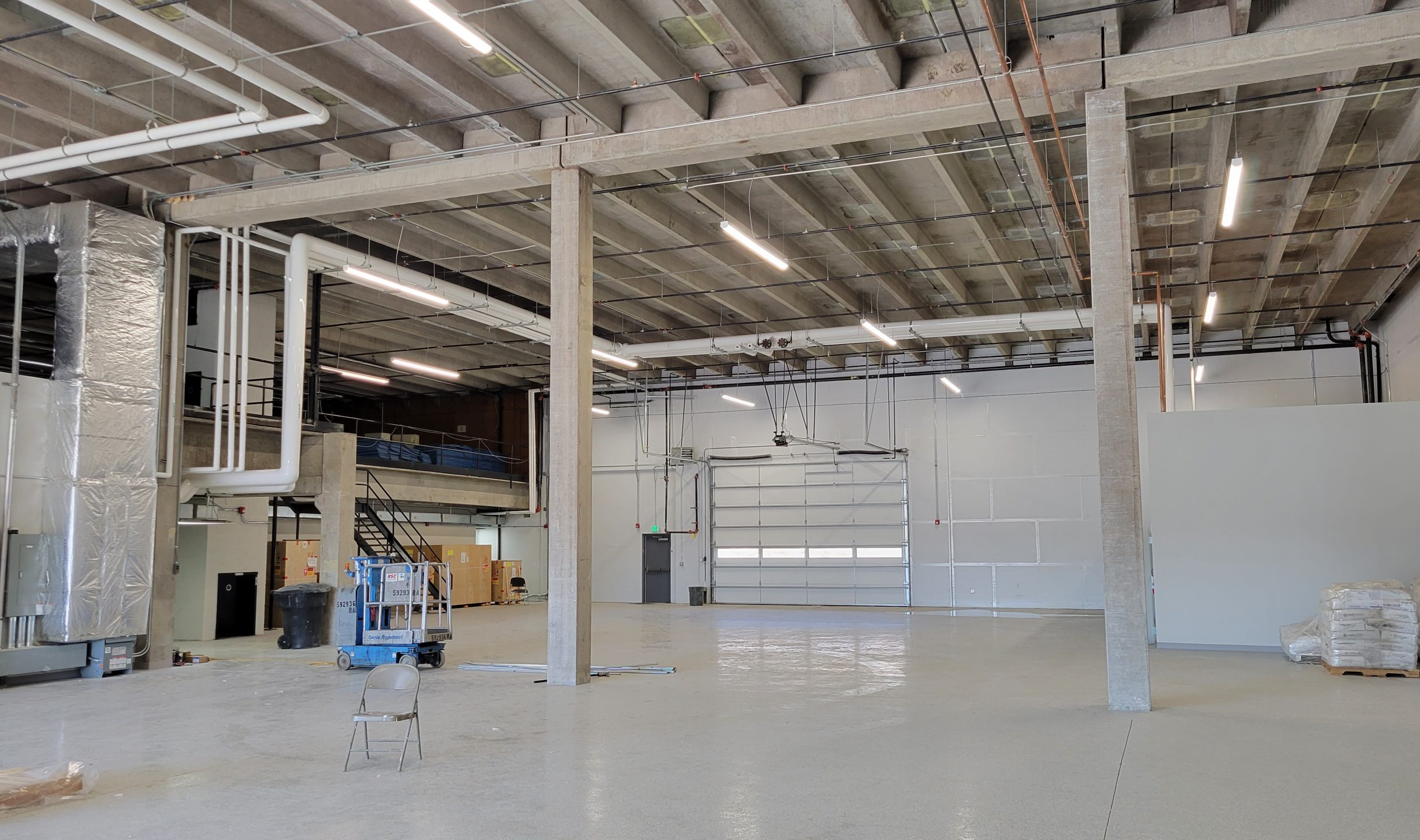The inside of the receiving area of San Rafael showing the bay doors and a palate of cargo